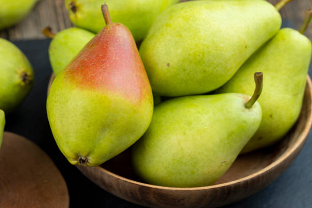 istock fresh harvest of pears on the table in the kitchen 1866878707