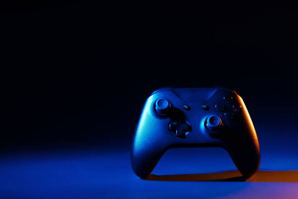 istock Gaming joystick on black background in neon light 1866878962