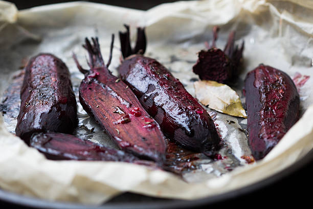 Baked whole beet with olive oil and herbs stock photo