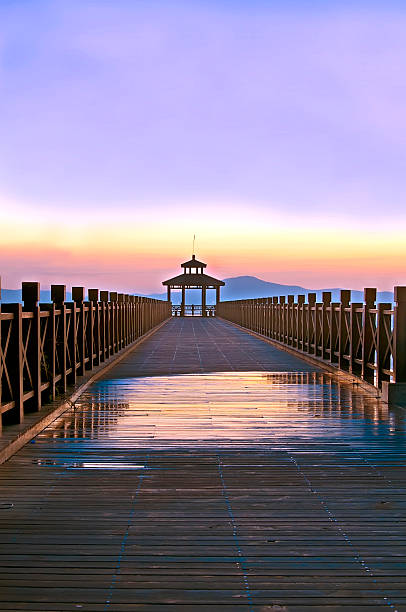 istock old wooden pier when the sun rises 186688174