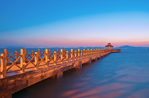 istock old wooden pier when the sun rises 186688178