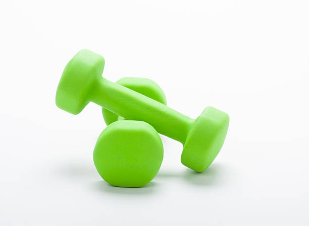 istock small green dumbbells,  isolated in white 186688549