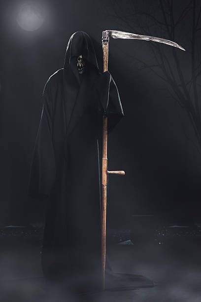 istock death with scythe standing at night 186688707