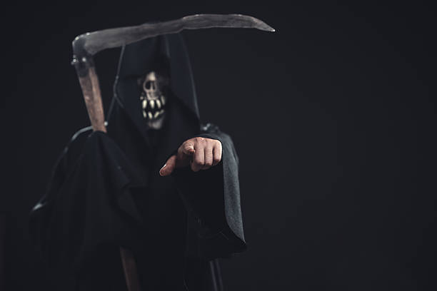 istock death with scythe standing at night 186688723