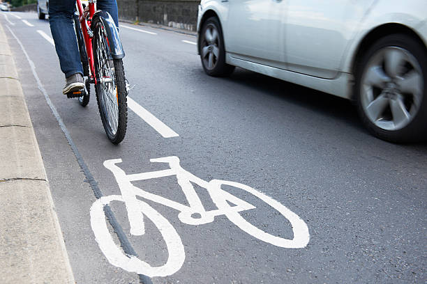 istock Man riding bicycle in cycle lane 186688990
