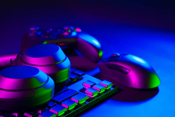 istock Headphones, computer mouse and keyboard on black background 1866890175