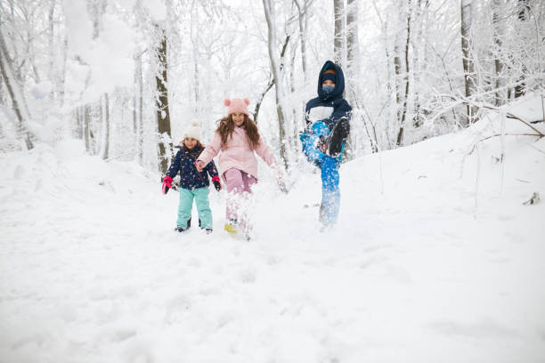 istock Beautiful children enjoying winter day 1866895489