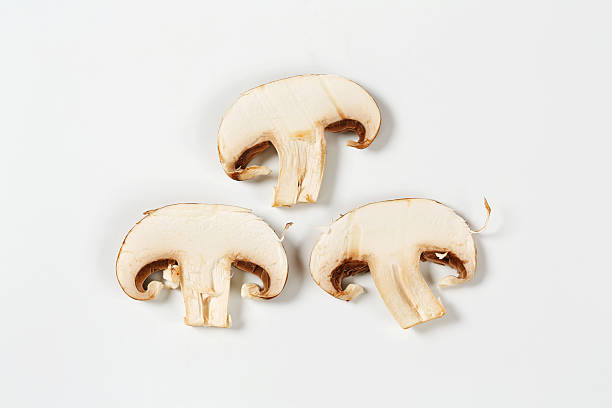 istock Sliced champignon mushrooms isolated on white 186690470