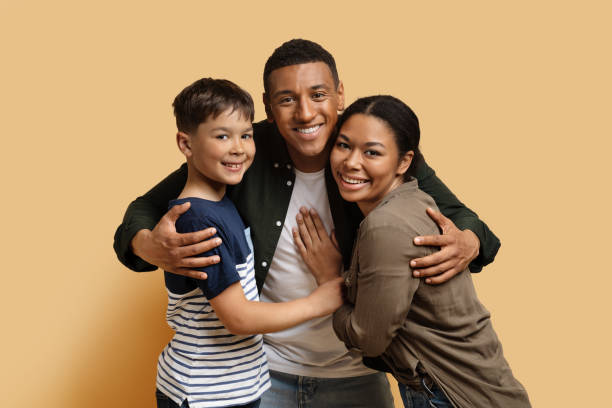 istock Handsome millennial black man hugging wife and son 1866925369