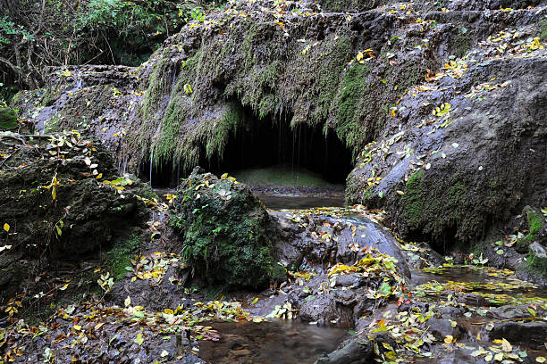 Bottom of the Green Rock waterfall and a grotto in the rock in the fall outside the city of Lovech near Krushuna village  in Bulgaria