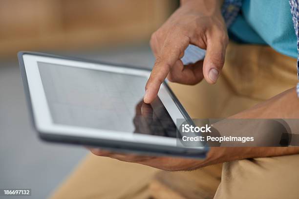 Unlock The World With A Touch Of Your Hand Stock Photo - Download Image Now - Digital Tablet, Adult, Adults Only