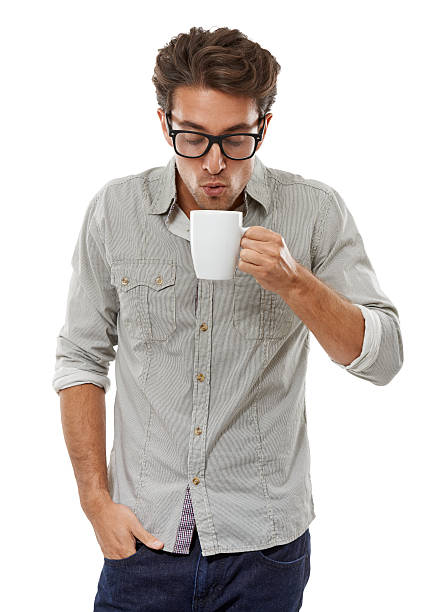 istock Blowing on a hot cup of coffee 186697694