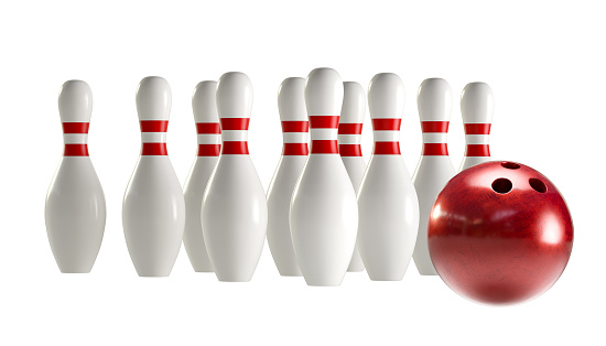 Bowling pins in the bowling alley before blue background. Horizontal composition with copy space. Bowling concept.