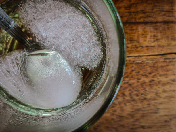 istock Glass Filled With Ice Cubes On A Wooden Table 1866993330
