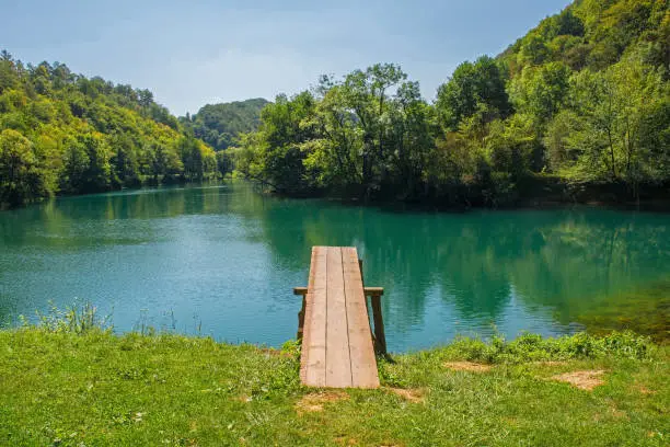 A wooden diving board on the River Una near Orasac, Bihac, in the Una National Park. Una-Sana Canton, Federation of Bosnia and Herzegovina. Early September