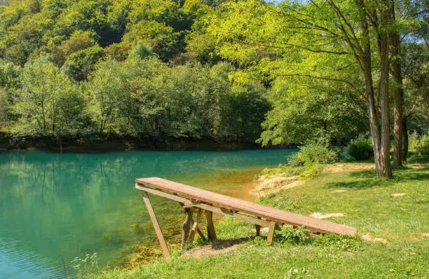 A wooden diving board on the River Una near Orasac, Bihac, in the Una National Park. Una-Sana Canton, Federation of Bosnia and Herzegovina. Early September