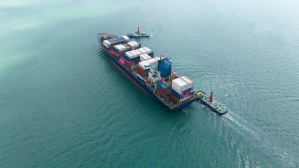 istock Container cargo ship in the ocean at sunset blue sky background with copy space, Nautical vessel and sea freight shipping, International global business logistics transportation import export concept 1866995408