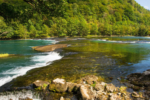 Troslap Lohovo, a small waterfall in the River Una near Lohovo, Bihac in Una-Sana Canton, Federation of Bosnia and Herzegovina. Located within the Una National Park. Early September