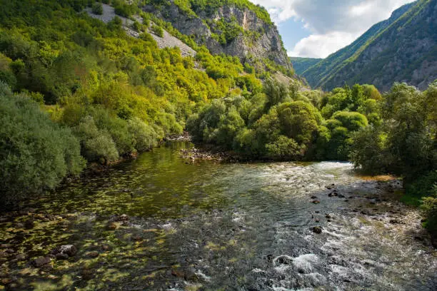 The River Unac as it flows through Martin Brod, Bihac, in the Una National Park. Una-Sana Canton, Federation of Bosnia and Herzegovina. Early September