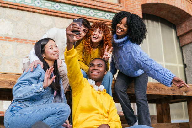 Diverse Friends Sharing Joyful Selfie Moment Outdoors