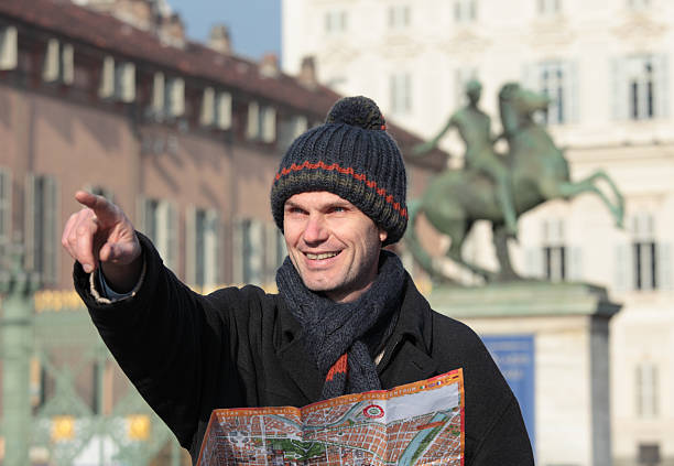 istock Tourist with city plan 186701361