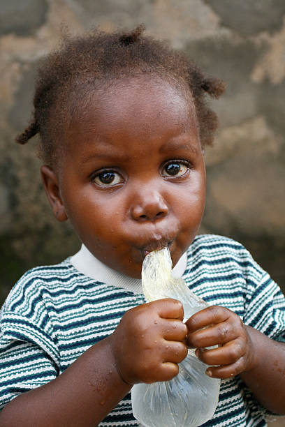 istock African Toddler Drinking Water 186701578