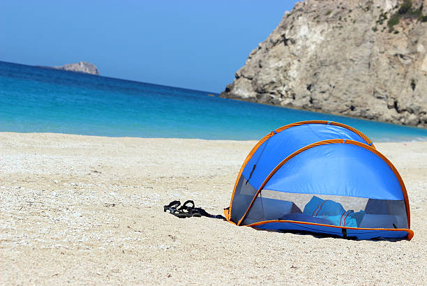 Camping tend at the amazing Egremni Beach- Lefkada Island (Greece) This kind of camping tend is very common in all Lefkada.  This is one of the most beautiful beaches in the whole world. It is located at the Lefkada Island (Levkas). egremni beach lefkada island greece stock pictures, royalty-free photos & images