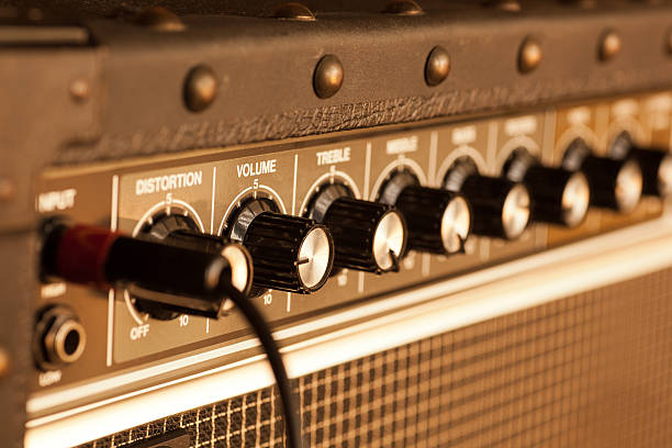 istock Row of twist button controls on a guitar amp 186701753