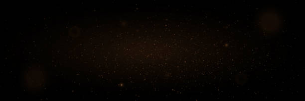 istock Golden glitter. Flare light effect. Shiny background of particles and light. 1867018925