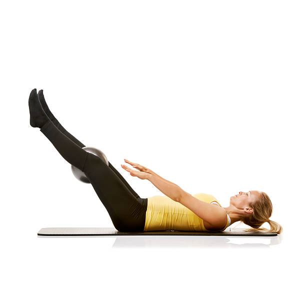 istock Strengthening her core with leg lifts 186701960