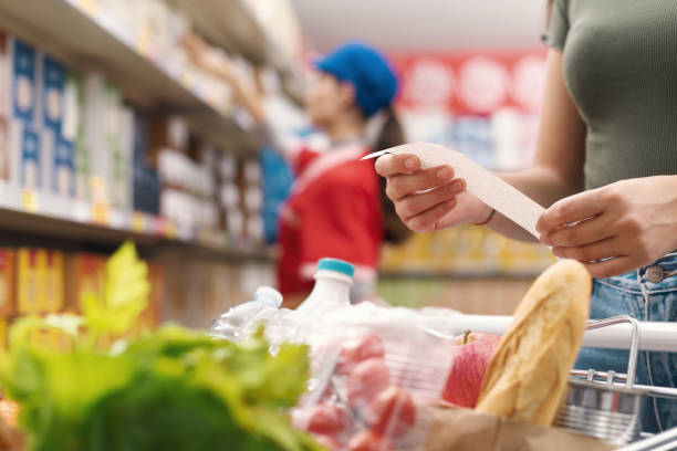 istock Woman checking the grocery receipt 1867023655