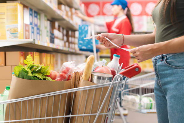 istock Woman checking the grocery receipt 1867027084