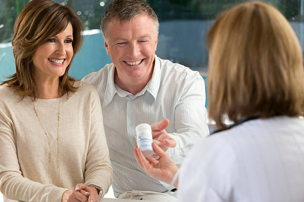 istock Mature couple getting medicine from doctor 186703900