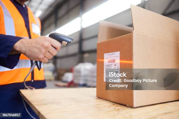 Scan Code For Box Worker Using A Bar Code Reader To Scan Boxes At A Warehouse Table Stock ...