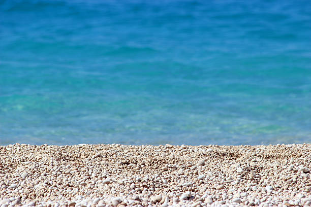 Egremni Beach an its white little stones- Lefkada Island (Greece) The particular beach also have little white and circular stones all over the place.   egremni beach lefkada island greece stock pictures, royalty-free photos & images