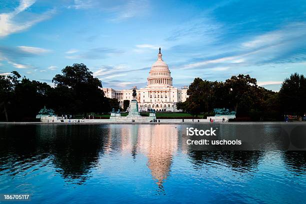 Us Capitol Building Reflecting In Water With Blue Sky Stock Photo - Download Image Now