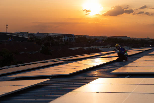 istock In silhouette, engineer checking solar panel roof top in evening 1867055441