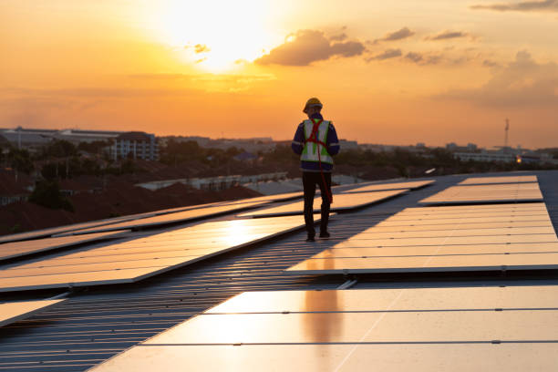 istock In silhouette, engineer checking solar panel roof top in evening 1867055993