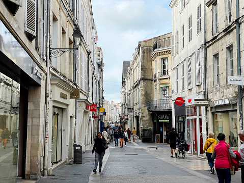 Shoppers on the street in the old French town of La Rochelle