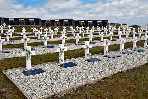 Teal Creek, Darwin, East Falkland, Falkland Islands (Islas Malvinas): Argentine Military Cemetery - Holds the remains of 236 Argentine combatants killed during the 1982 Falklands War. Each grave is marked by a white wooden cross with the name of the soldier on it, if known, or Soldado Argentino Solo Conocido Por Dios (