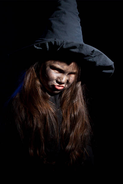 istock The little witch with halloween pumpkin 186708413