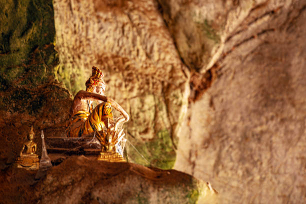 Luang Prabang, Laos - July 16, 2015: Nestled along the Mekong River near Luang Prabang, the Pak Ou Caves in Laos are a cultural and spiritual treasure. Accessible by a scenic boat ride, these limestone caves house thousands of Buddha statues, forming a unique pilgrimage site.