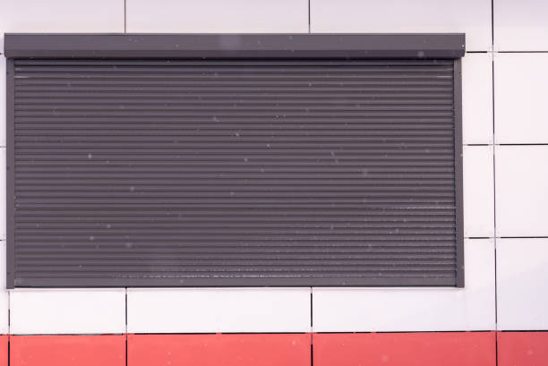 istock Closed blinds outdoors in shop windows. Closed workplaces.Copy space. 1867092625