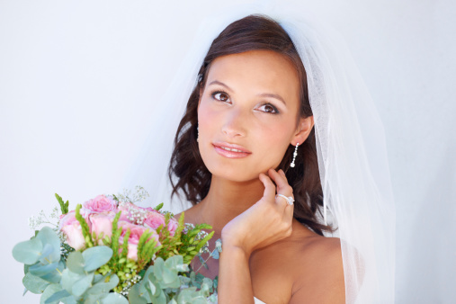A gorgeous young bride holding her bouquet
