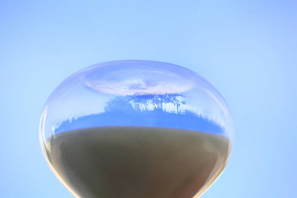 Empty glass on the background of the reflected sky