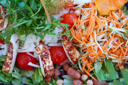 Portion of mix salad - cheese, carrots, beans, Lettice, chickpeas, zucchini, Slovenia.