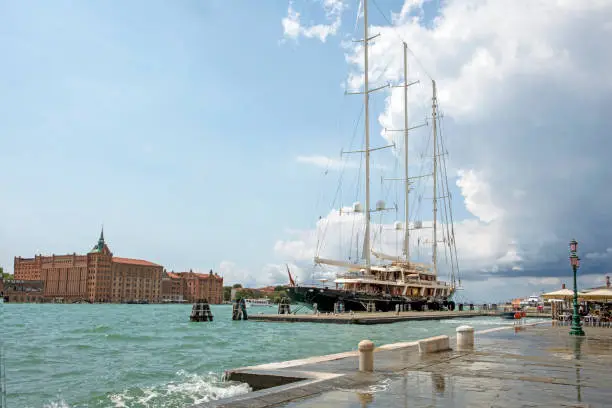 pleasure boat with three matches is berthed in Venice. rest and travel