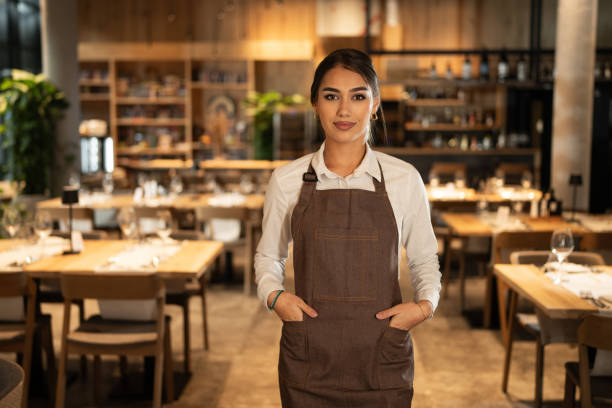 istock Beautiful waitress in restaurant 1867102586