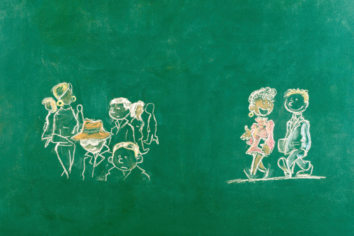 Standing out from the crowd concept sketched on blackboard