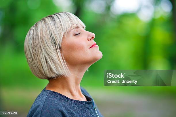 Attractive Woman Breathing And Relaxing Stock Photo - Download Image Now - Breathing Exercise, Mature Women, Mature Adult